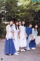 A group of young women standing next to each other.