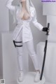 A woman in a white outfit holding a sword.