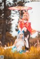 A couple of women standing next to each other in a field.